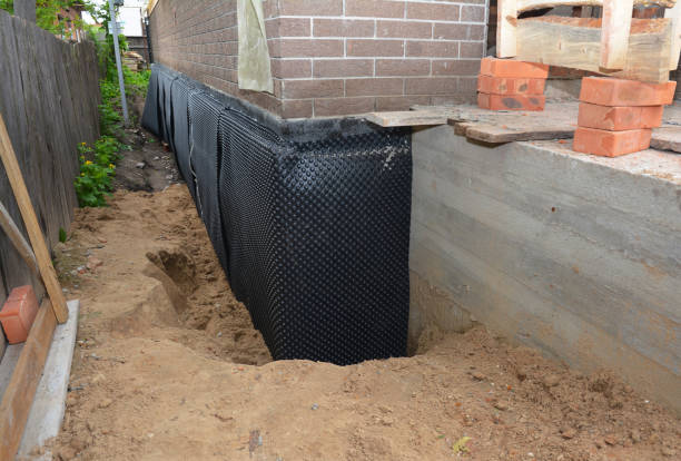 Happy homeowners after waterproofing job in Piffard